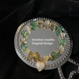Emerald Wonderland: Heart Pearl Bracelet