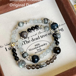 Aquamarine, Ice Quartz, Hawk Eye, Blue Tiger's Eye, and Black Hair Crystal Designed Bracelet