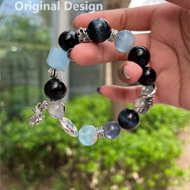 Aquamarine, Blue Tiger's Eye, Silver Quartz, Black Hair Crystal, and Cross Crystal Designed Bracelet