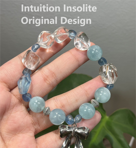 Aquamarine, Black Gold Super, White Crystal, and Bowknot Crystal Designed Bracelet