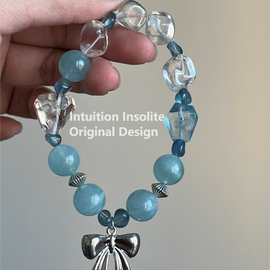 Aquamarine, Black Gold Super, White Crystal, and Bowknot Crystal Designed Bracelet